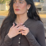 Featuring Emily Singer in the Margaux Baroque Pearl Earrings, Étoile Huggies and Celestial Prayer Ring